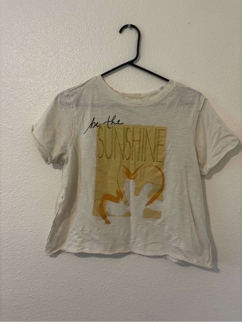 Anthropologie  Cream Tee with Yellow Sunshine Graphic